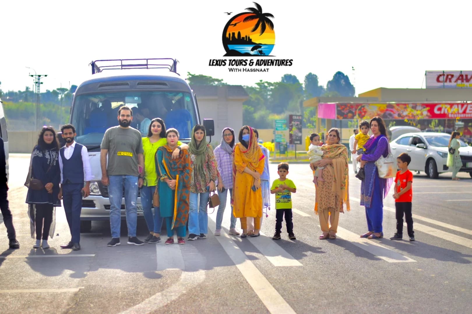Lexuz travellers gathered beside a tour vehicle